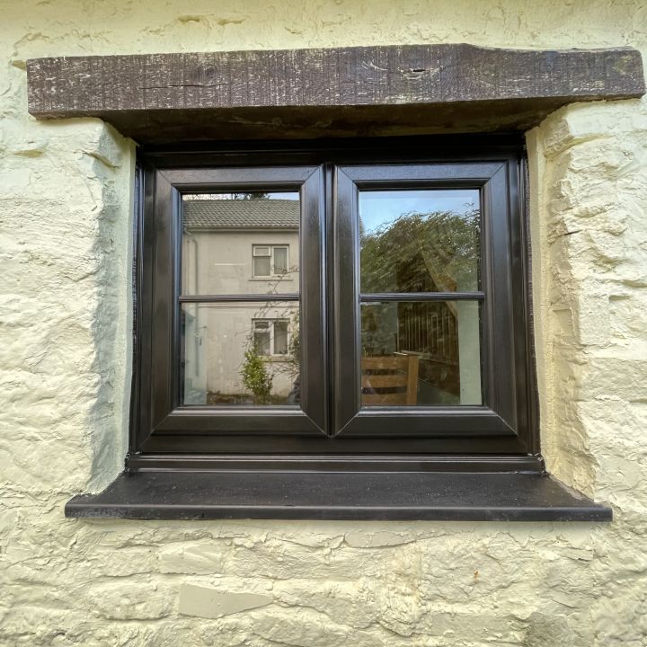 Black A rated casements windows, face mounted Georgian bars.